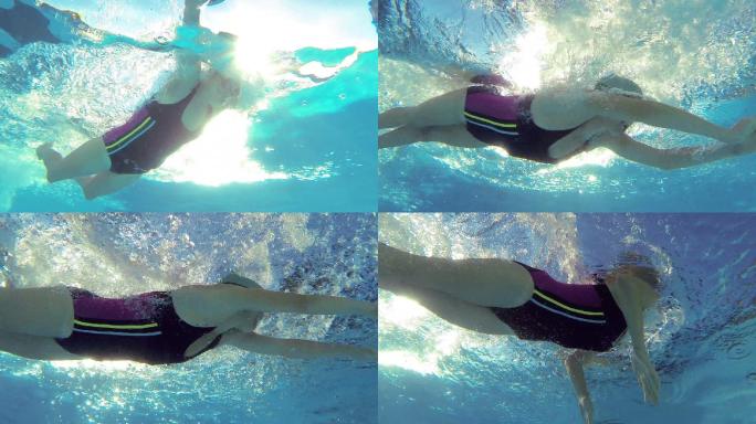 游泳运动员在游泳池游泳与go pro相机拍摄