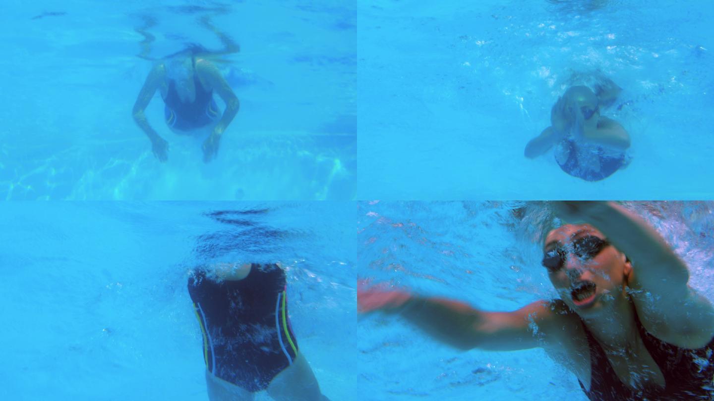 低角度视角的适合游泳者在游泳池做蝶泳