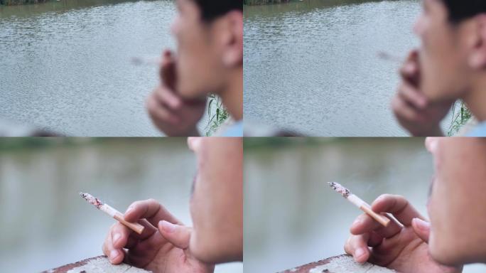 忧愁男人河边抽烟