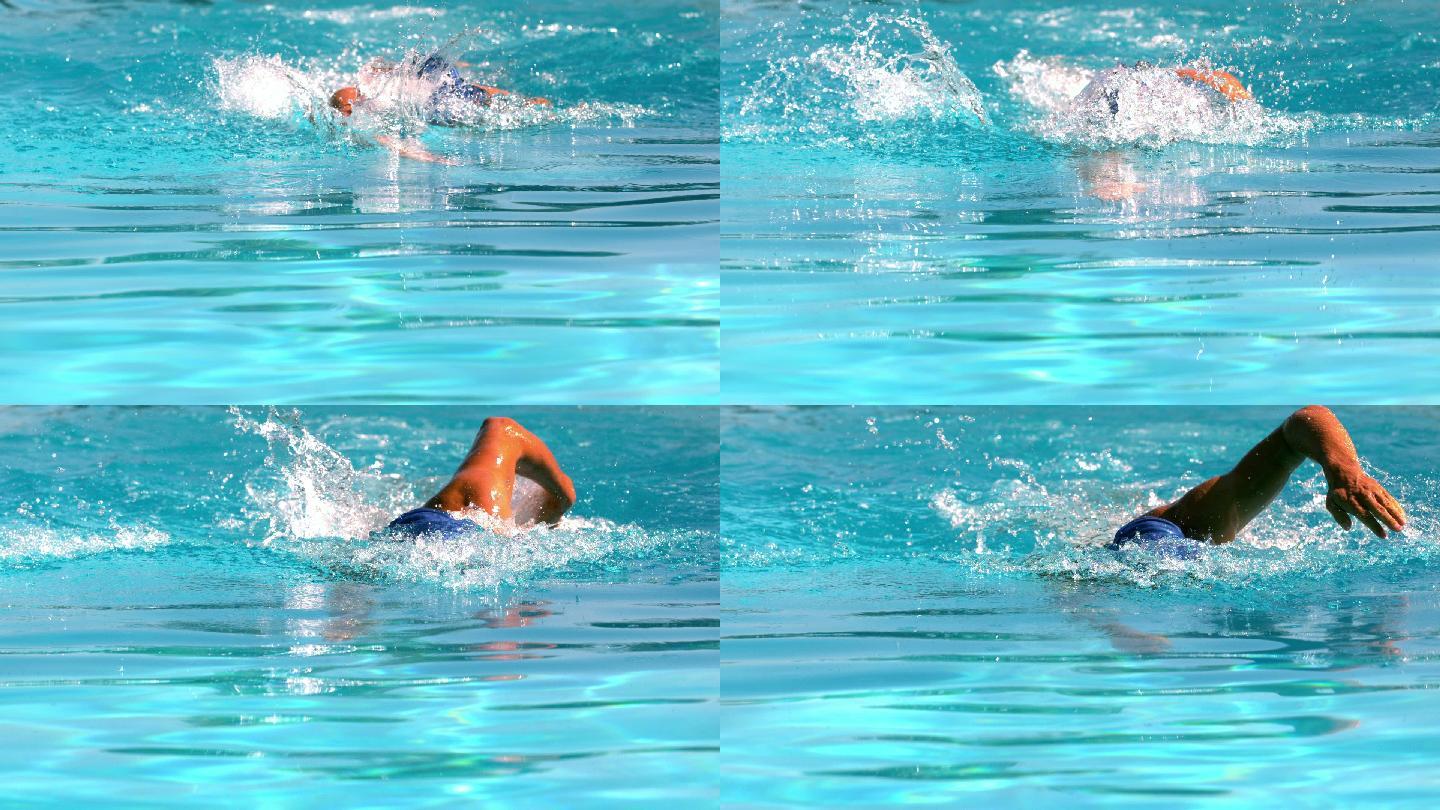 健康的游泳者在游泳池中用慢动作向前划水