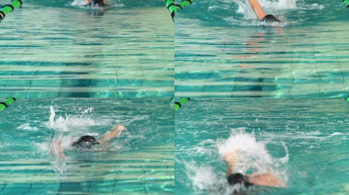 健康的游泳者在休闲中心的游泳池里做前划