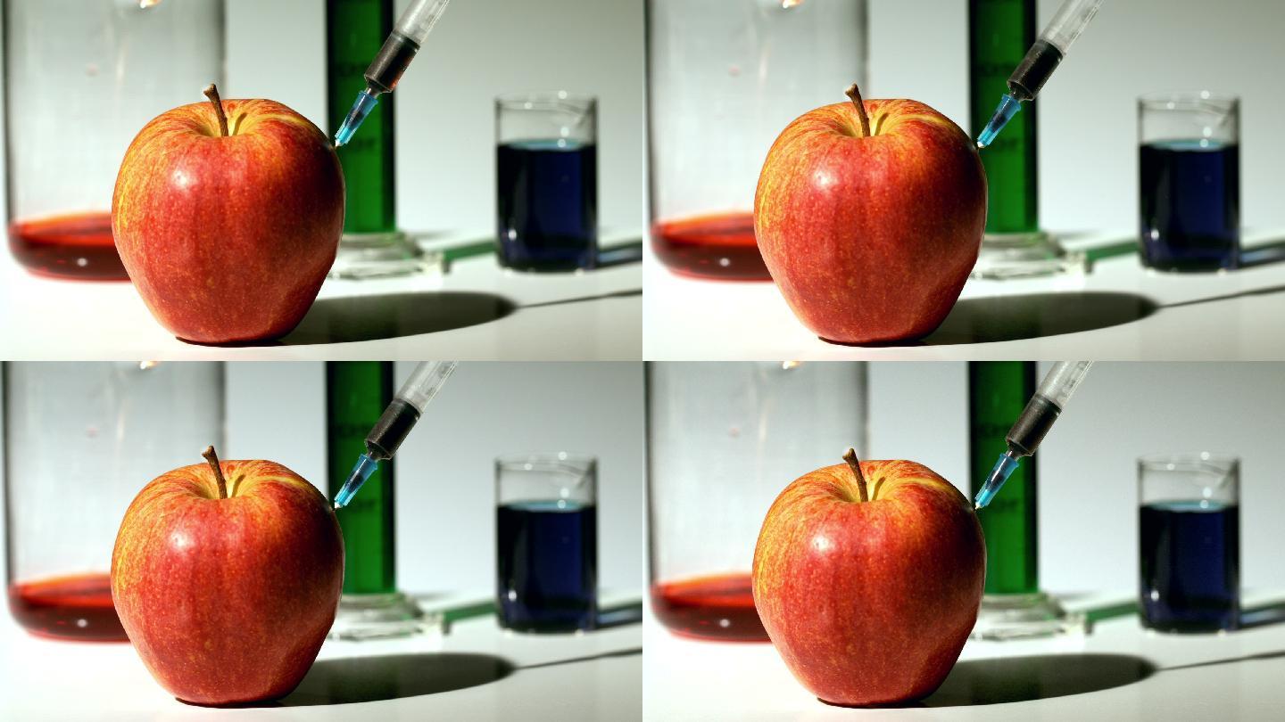 用注射器将化学物质慢动作注入苹果
