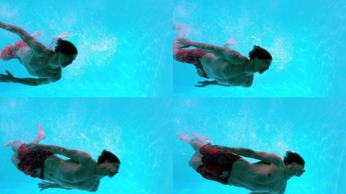 健康人在游泳池里慢动作游泳