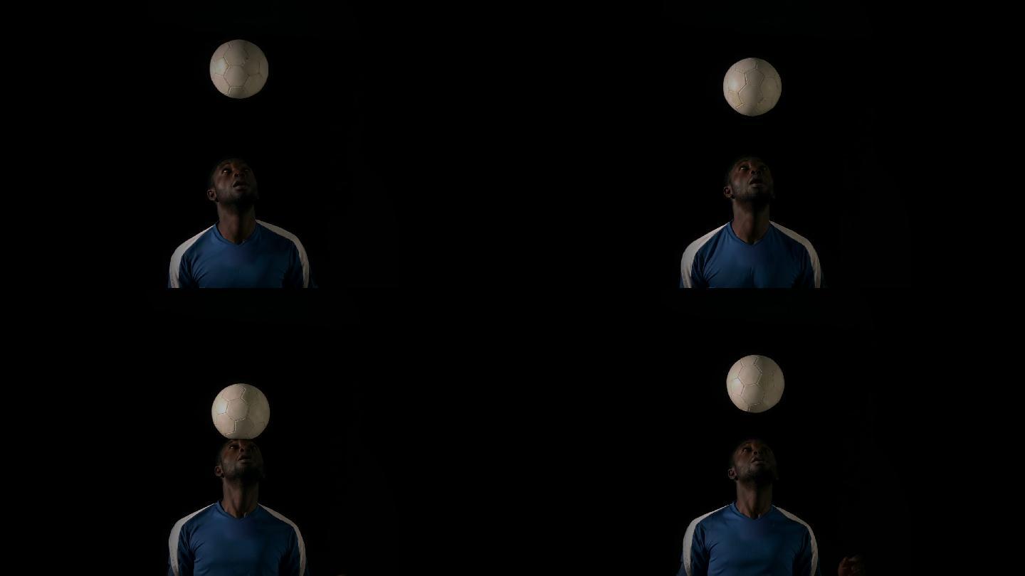 足球运动员用慢动作顶球