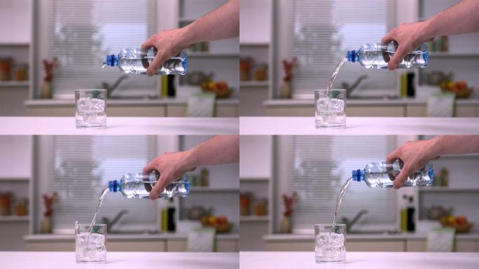 用手将水倒入玻璃杯中的慢动作