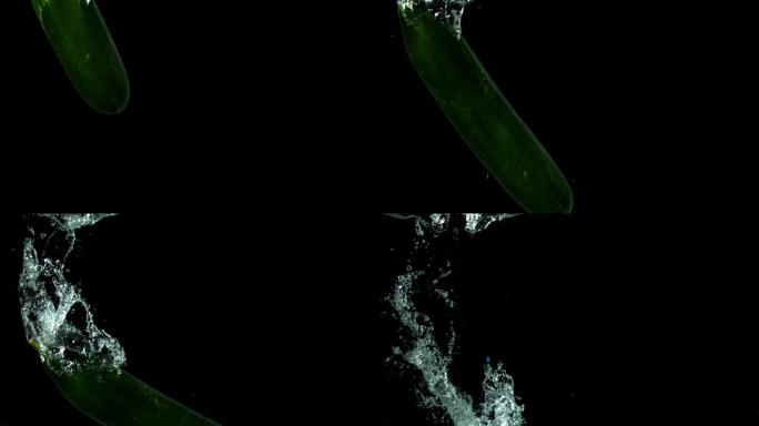小胡瓜在黑色背景下落入水中的慢动作