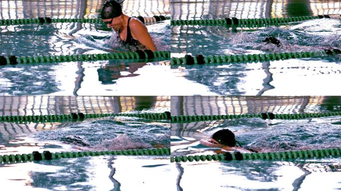 健康的女子游泳运动员在游泳池中慢动作做蝶泳动作