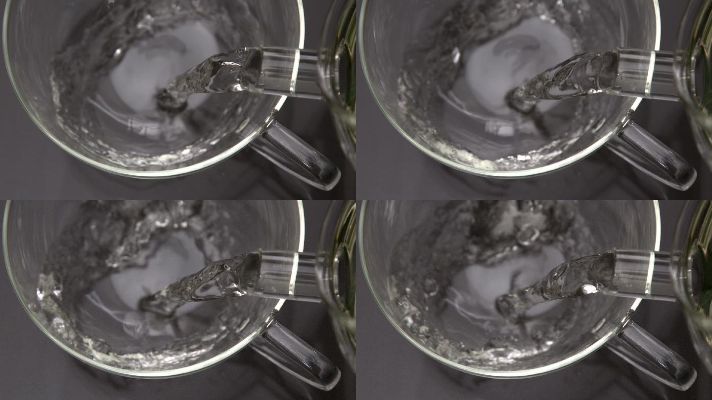 热水从茶壶倒入玻璃杯中的慢动作