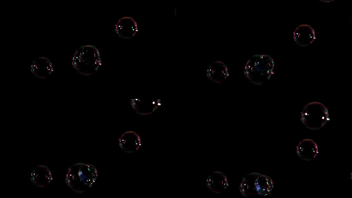 气泡漂浮在黑色背景的慢动作
