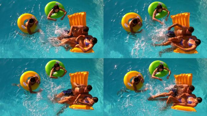 在慢镜头中，朋友们一起在游泳池里玩得很开心，溅起水花