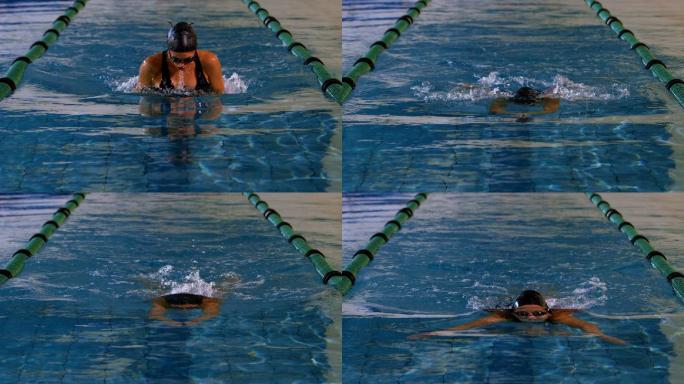健康的女子游泳运动员在游泳池慢动作蛙泳