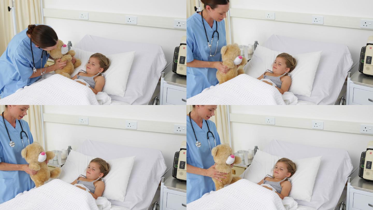 护士试图让医院里一个生病的小女孩高兴起来