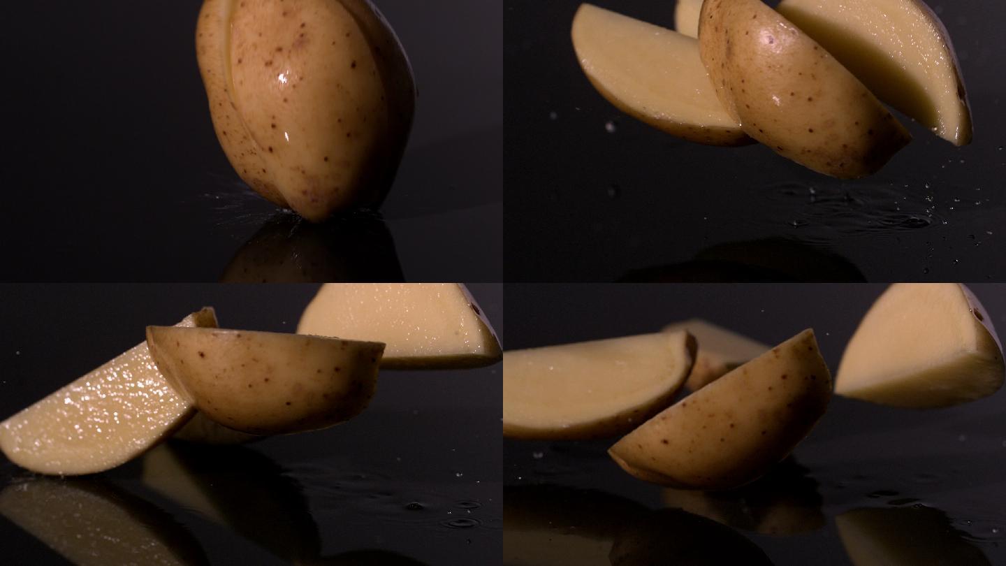 土豆片落在潮湿的黑色背景慢镜头