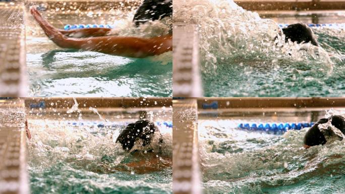 健康的游泳者以慢动作游到游泳池的边缘