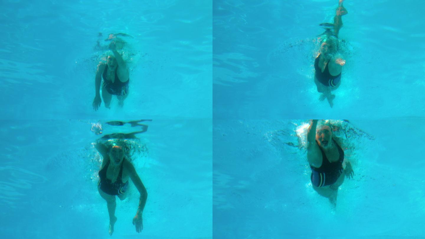 健身女子在室外游泳池慢动作游泳
