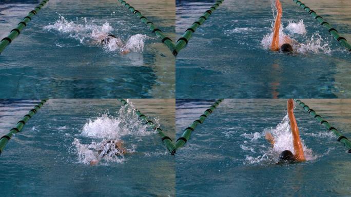 健康的女子游泳运动员在游泳池慢动作仰泳