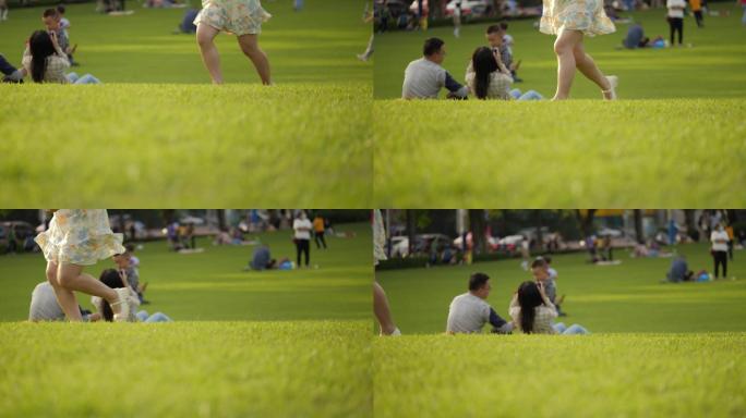 一个女孩跑过公园草坪