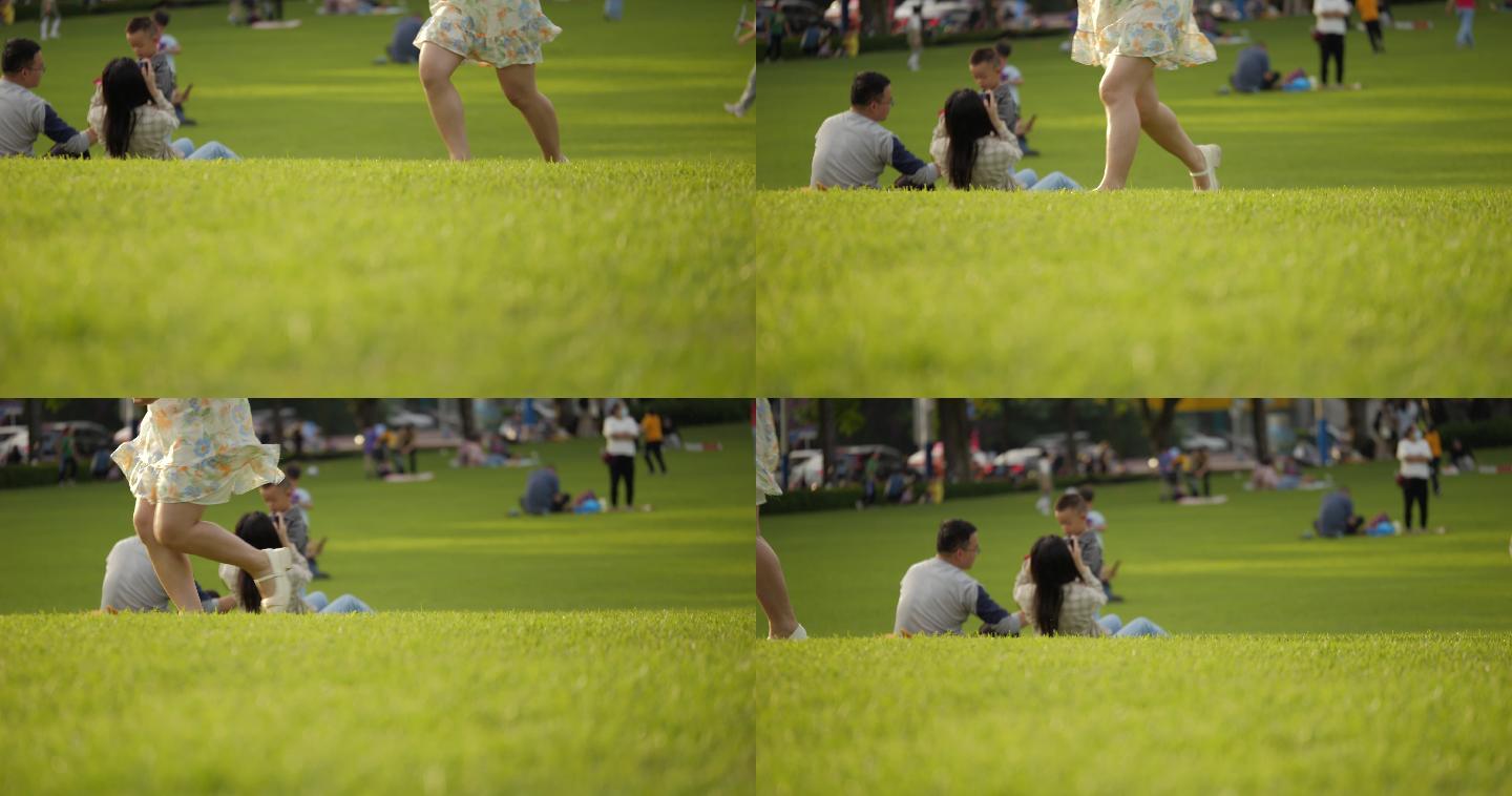 一个女孩跑过公园草坪