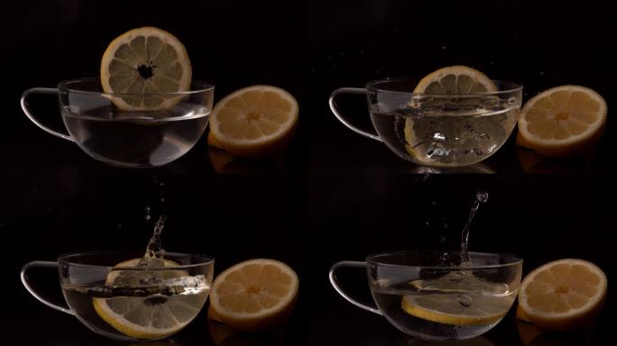 柠檬片在慢镜头中落入一杯水中