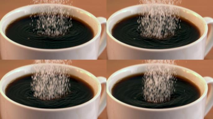 慢动作将糖倒入一杯咖啡中