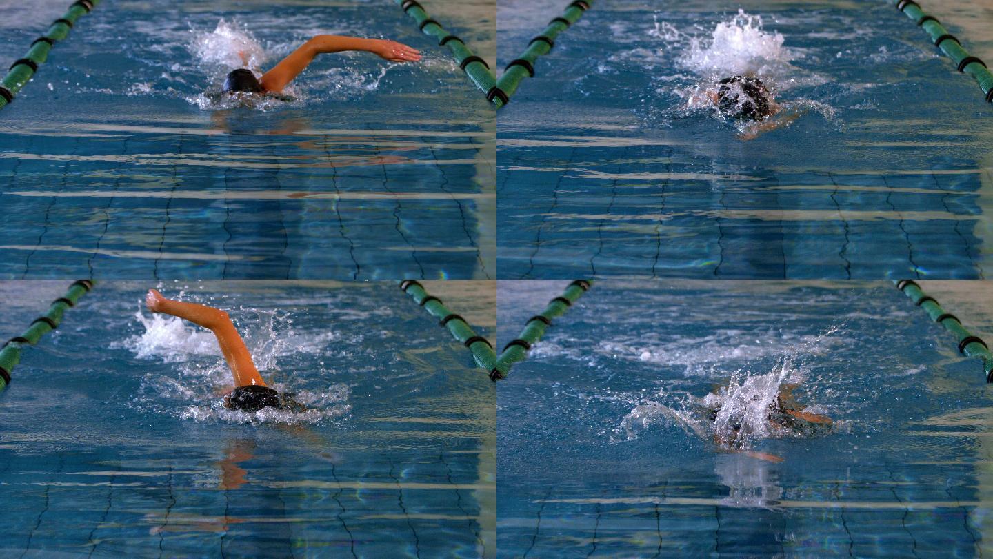 健康的女子游泳运动员在游泳池做缓慢的前泳