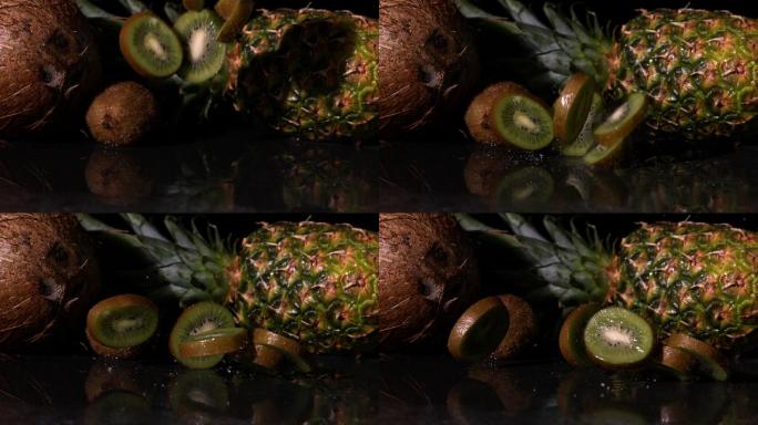 猕猴桃片落在菠萝和椰子前面的慢镜头
