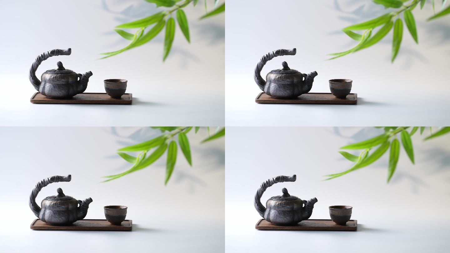 竹叶下的茶壶与茶杯