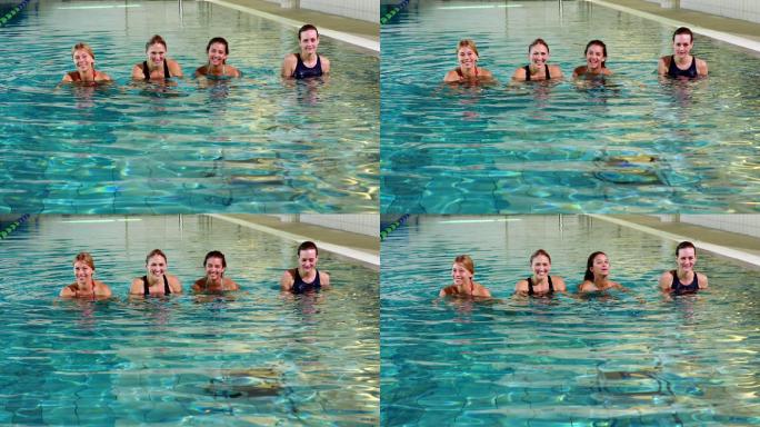 健身妇女在休闲中心做水中有氧运动