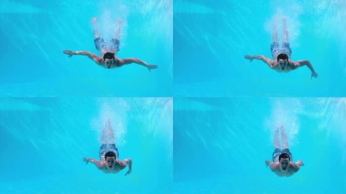 健康人在游泳池里慢动作游泳