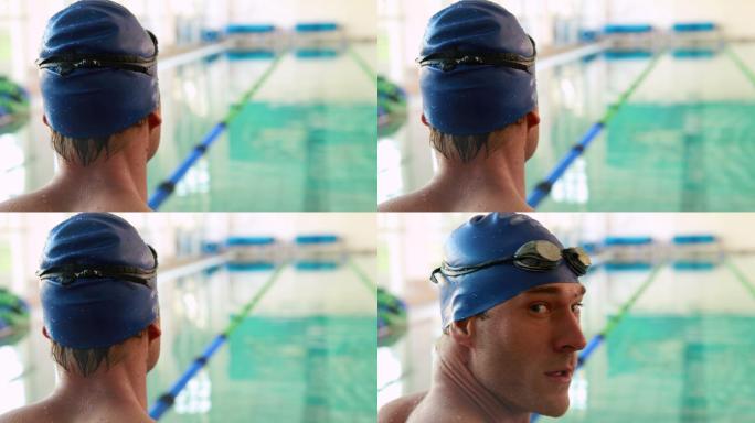 健身游泳者对着镜头微笑在游泳池在休闲中心