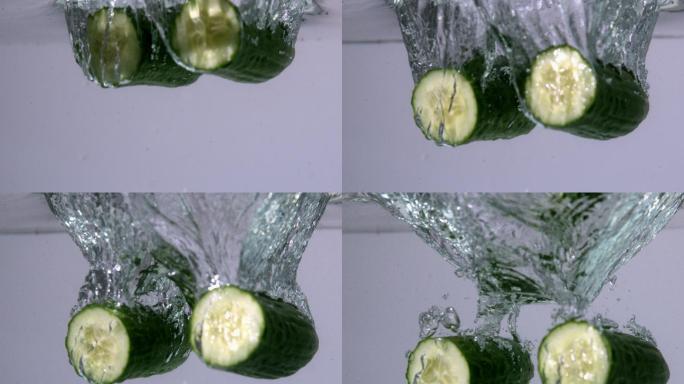 在慢镜头中，小胡瓜一半落在水中
