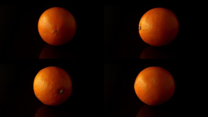 在慢镜头中，橙色在黑色表面上旋转
