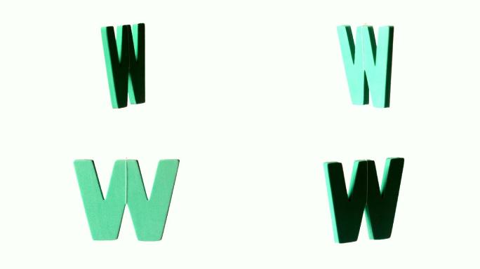 W磁铁旋转在白色背景慢动作