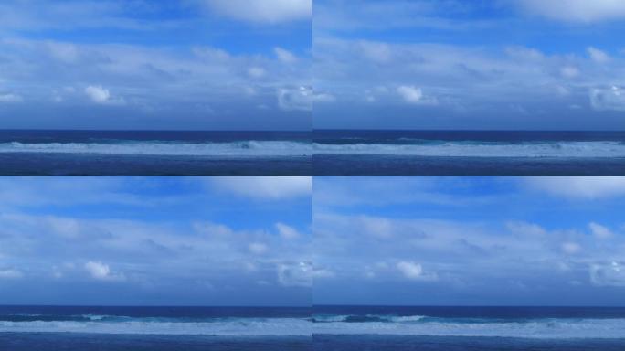 蓝天白云下大浪滚滚的海面