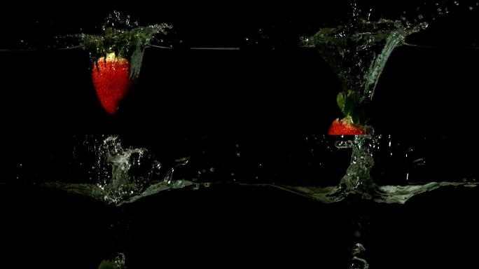 草莓落在水中的黑色背景慢镜头