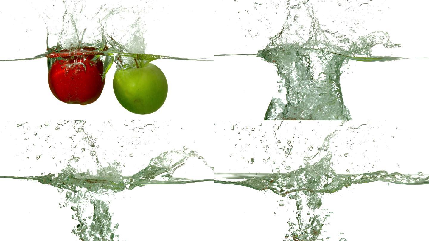 在慢镜头中，红绿苹果在白色背景下坠入水中