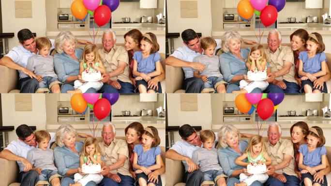 一大家族在客厅的沙发上庆祝小女孩的生日