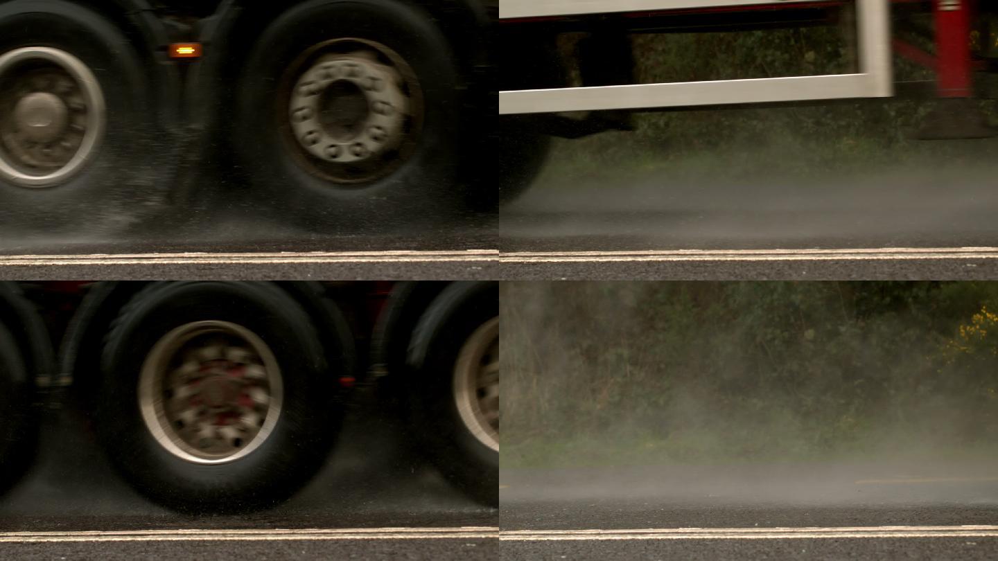 重型卡车在潮湿的路面上慢动作行驶