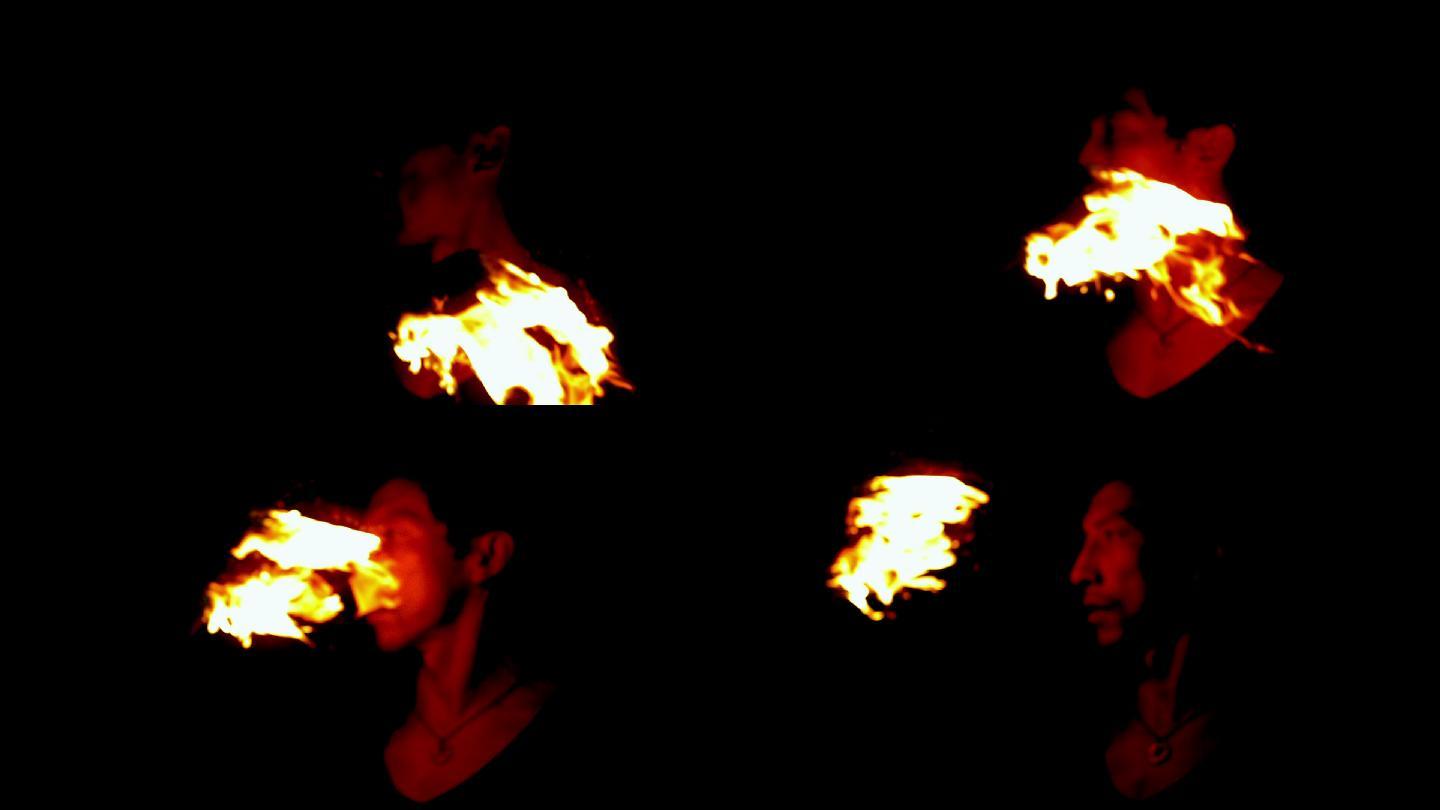 火焰舞者在黑暗中用慢动作将火焰从他的脸上掠过