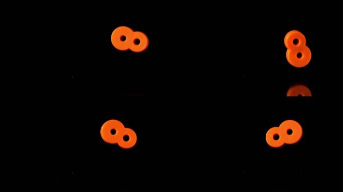 橙色8号落在黑色背景上的慢镜头