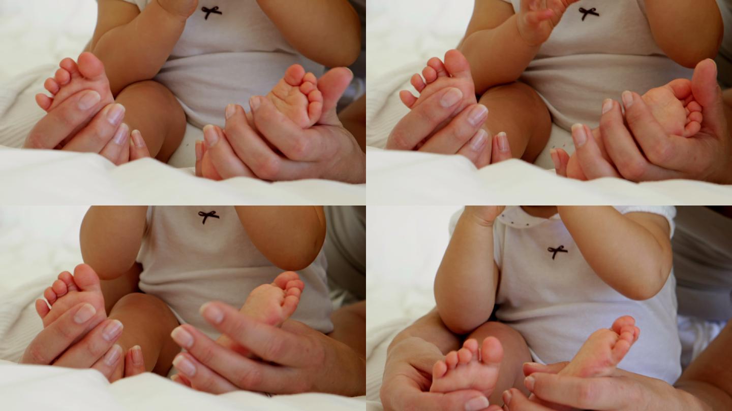 妈妈在卧室里抚摸着女儿的小脚趾