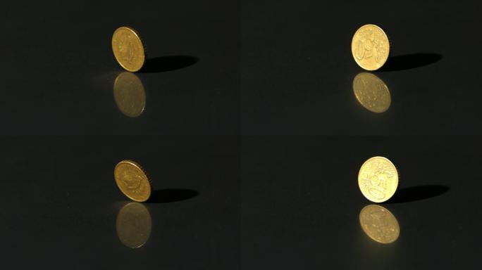 欧元硬币在黑色表面慢镜头旋转