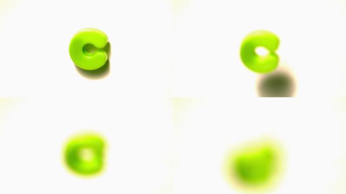 慢镜头中绿色字母c脱离白色背景