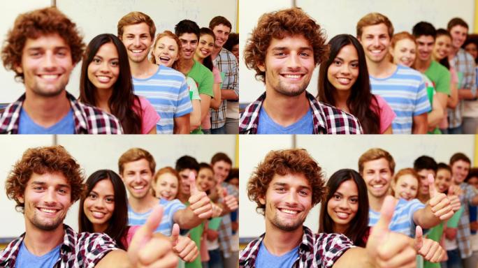 在大学里排队的学生们站在教室里对着摄像机竖起大拇指