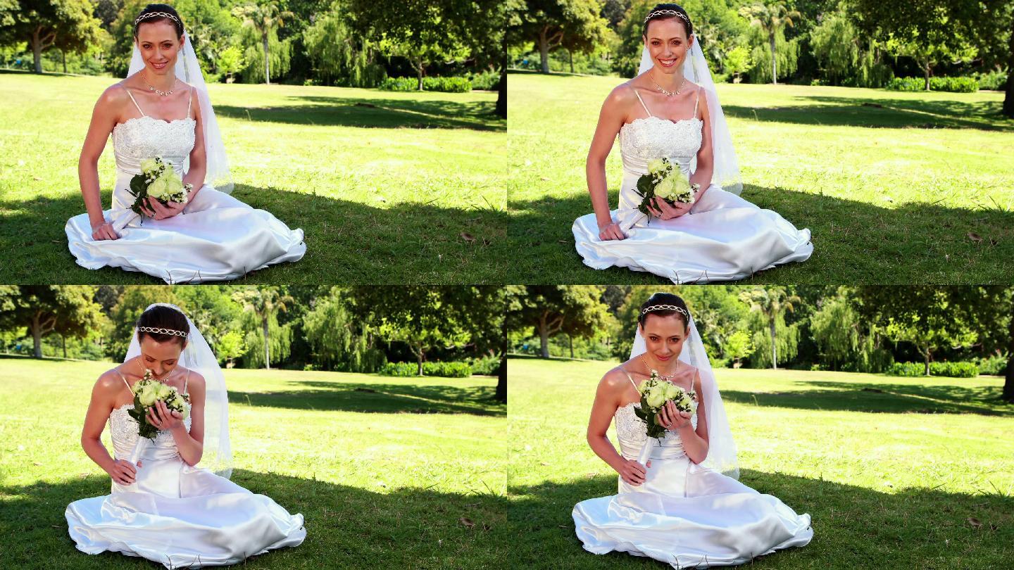 婚礼当天，心满意足的新娘坐在草地上