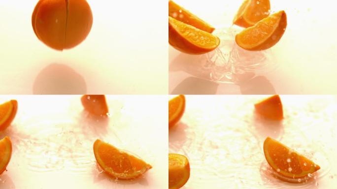 一片片的橙色在白色潮湿的表面慢动作地落下