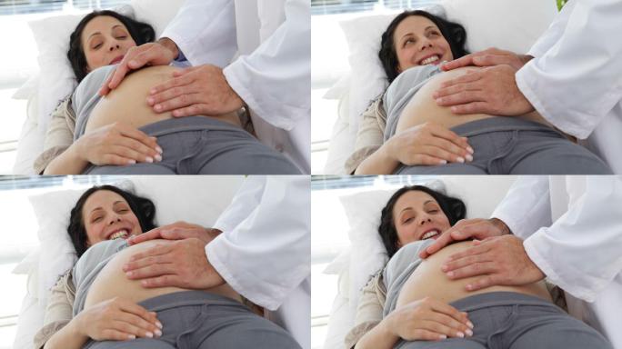 一位黑发孕妇正在医院接受医生检查