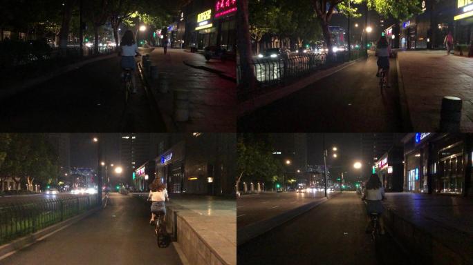 女生晚上骑自行车 共享单车