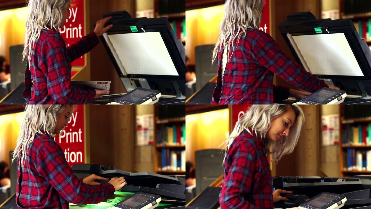 金发学生在大学图书馆使用复印机