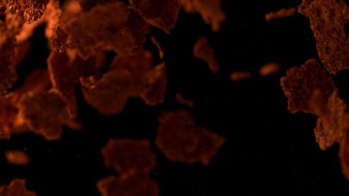 麦麸片在黑色背景的慢镜头中反弹